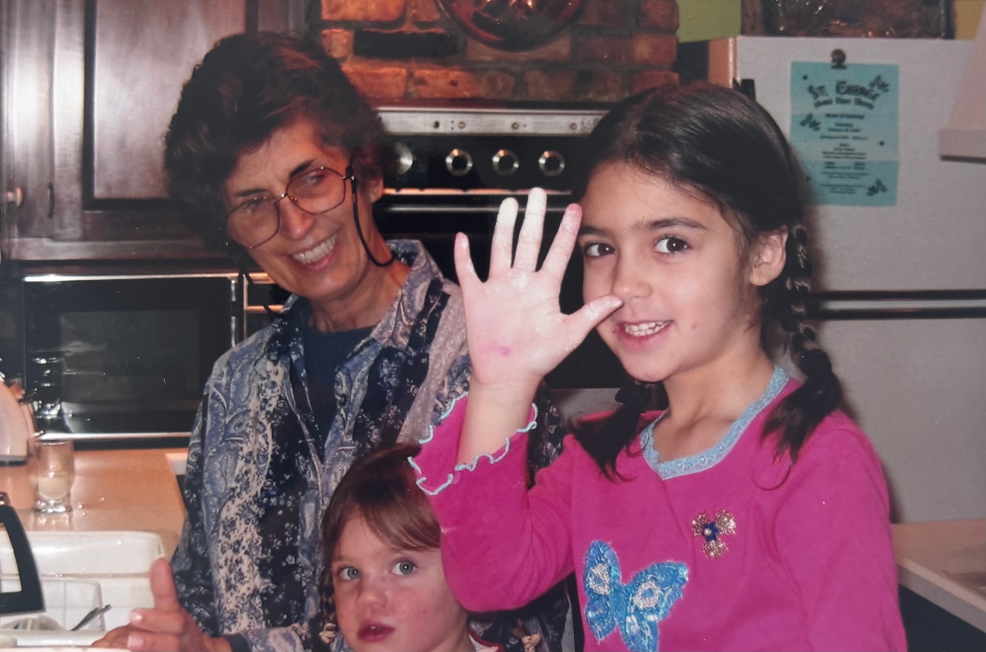 Young Syd baking with her Yiayia in a warm family kitchen